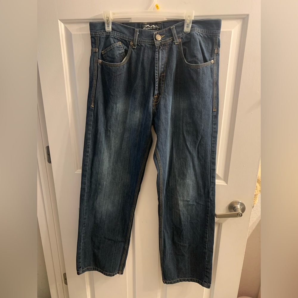 Blue jeans w/brown and white lines up and down brown bump lines at back pockets